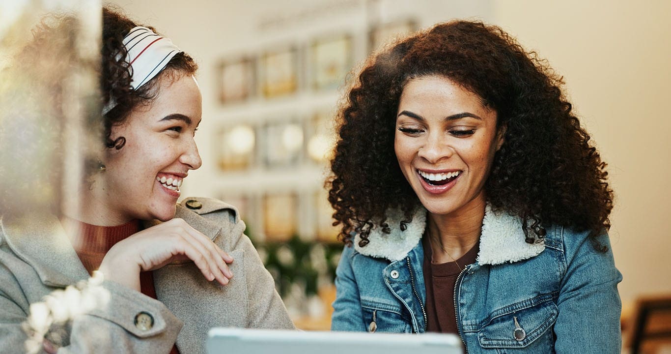 Women, friends and happy at cafe on tablet with goods news or email notification for job interview. People, sisterhood and smile or excited on website or online post for rewards and bonus on date Secure Hosting